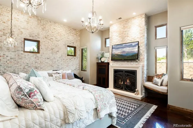 a spacious bedroom with a bed and a couch