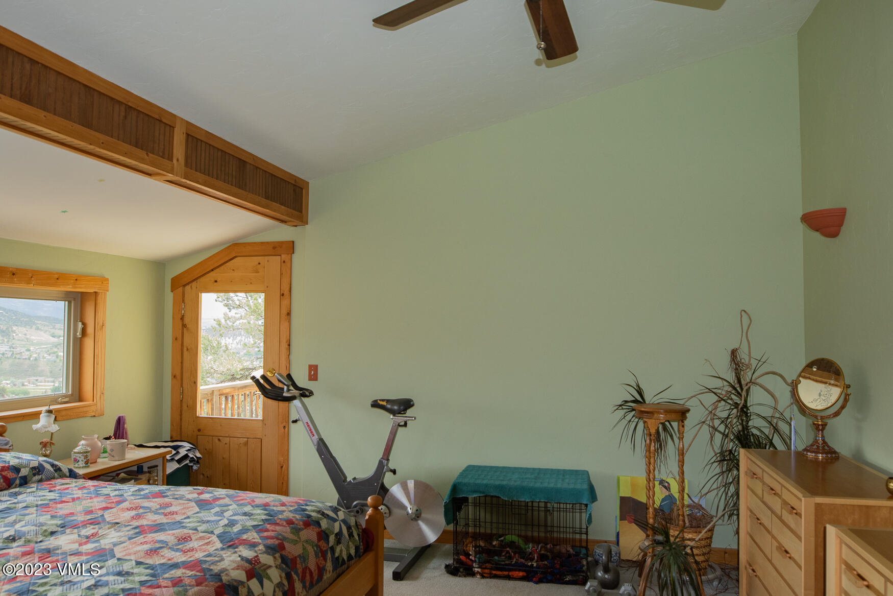 460 Mesa Drive Eagle, CO 81631 - Photo 14 of 42 a bedroom with a bed and a tv on the dresser
