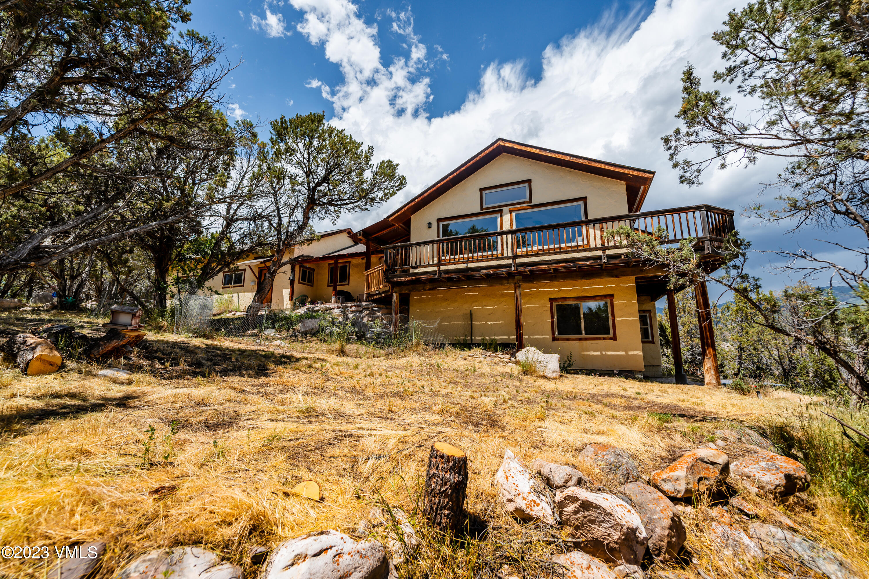 460 Mesa Drive Eagle, CO 81631 - Photo 38 of 42 a front view of a house with a yard covered with snow