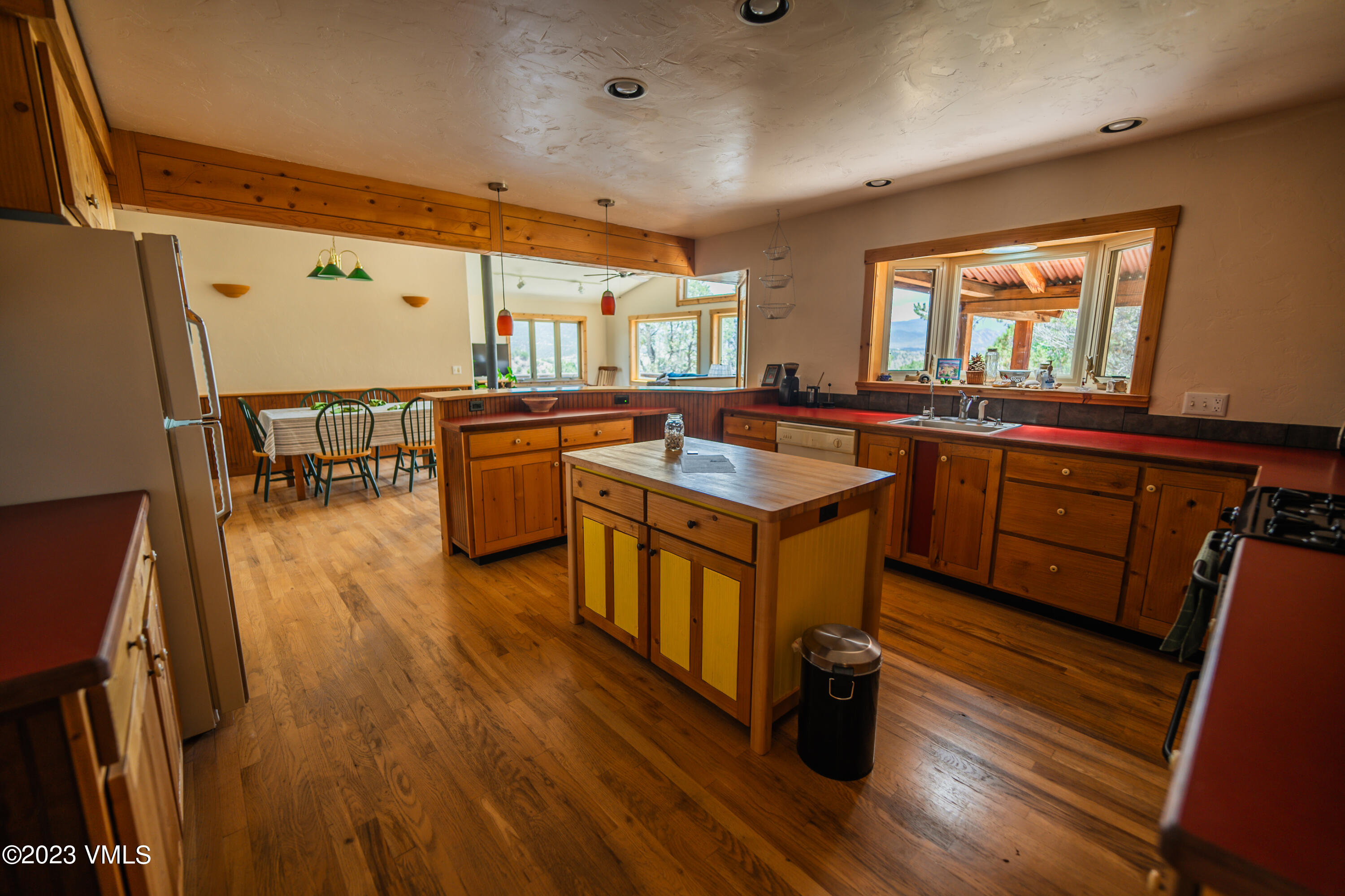 460 Mesa Drive Eagle, CO 81631 - Photo 10 of 42 a kitchen with lots of counter top space and wooden floor