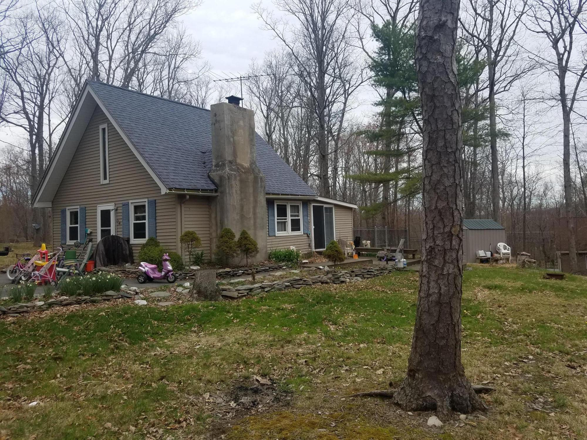 145 Yale Road Milford, PA 18337 - Photo 7 of 8 a front view of house with yard outdoor seating and green space