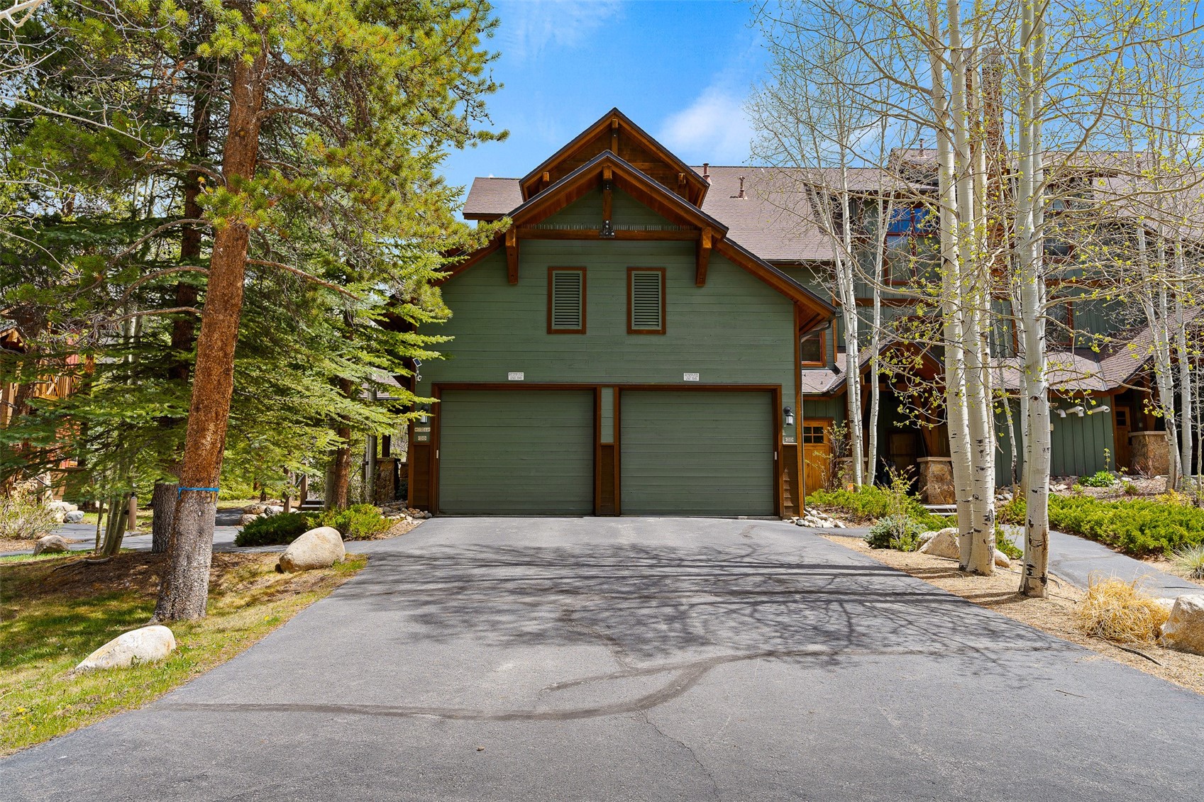 57 Lake Ridge Circle, Unit 1848 Keystone, CO 80435 - Photo 10 of 49 a front view of a house with a yard and garage