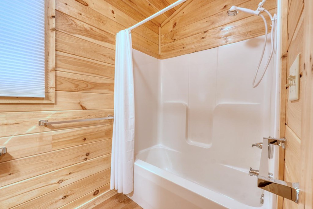 100 Fern Cv Lane Murphy, NC 28906 - Photo 25 of 28 a bathroom with a bathtub and a shower