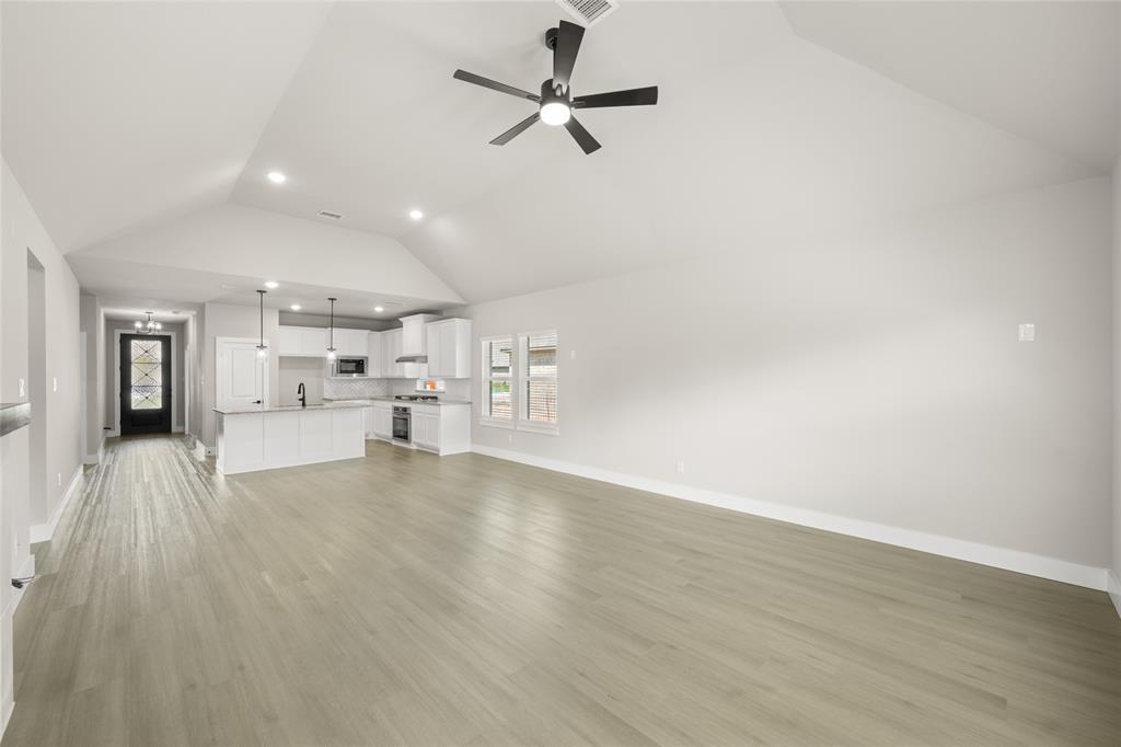 1850 Silver Birch Road Waxahachie, TX 75165 - Photo 18 of 36 a view of a kitchen with a sink and a refrigerator