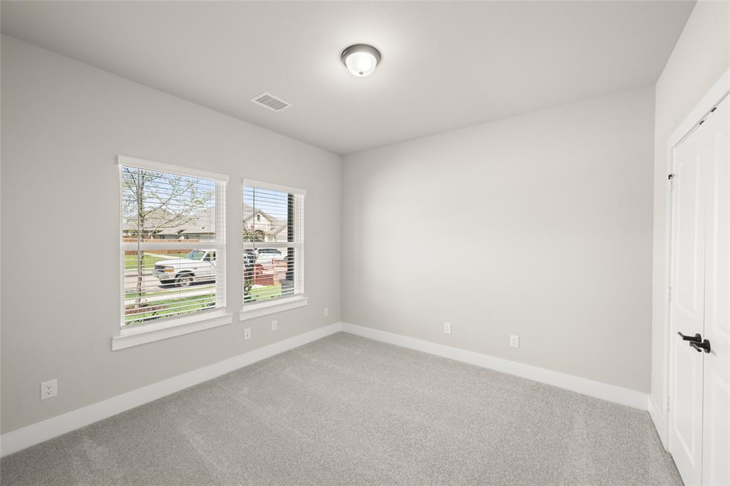 1850 Silver Birch Road Waxahachie, TX 75165 - Photo 19 of 36 an empty room with windows
