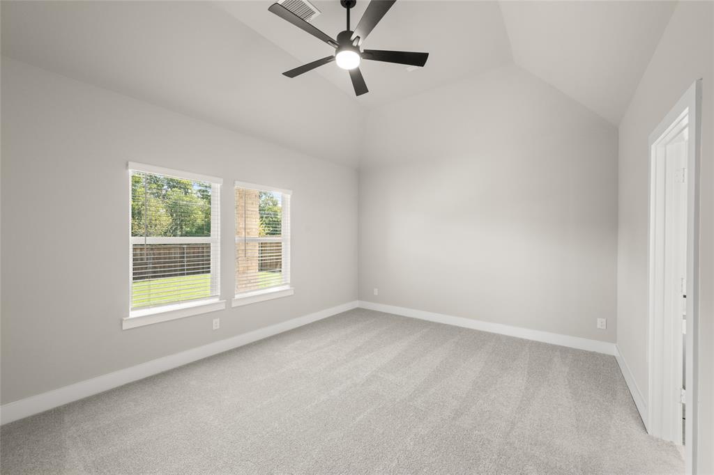 1850 Silver Birch Road Waxahachie, TX 75165 - Photo 21 of 36 an empty room with ceiling fan and window