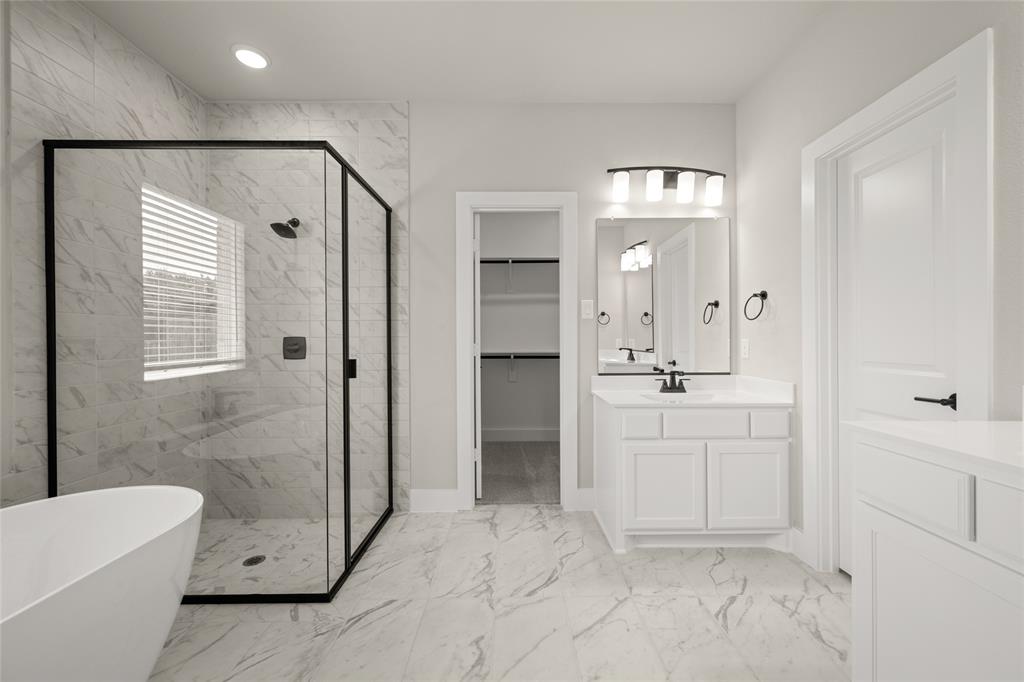 1850 Silver Birch Road Waxahachie, TX 75165 - Photo 23 of 36 a bathroom with a sink a toilet and shower