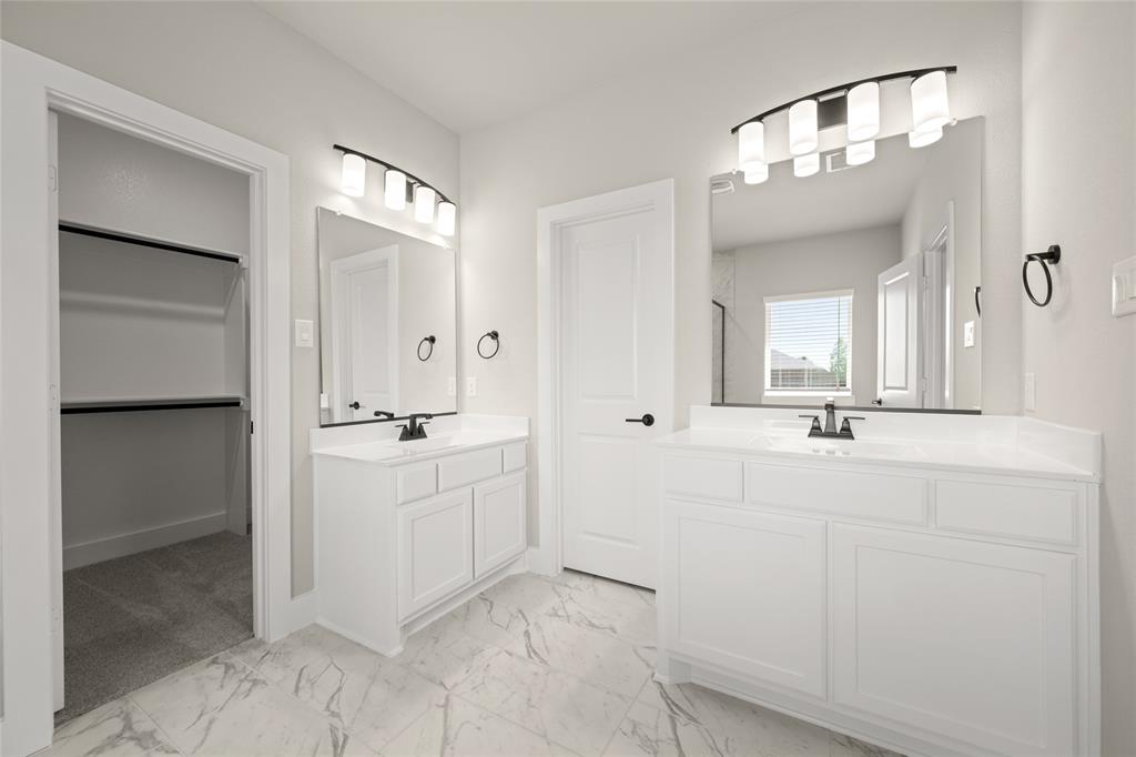 1850 Silver Birch Road Waxahachie, TX 75165 - Photo 24 of 36 a bathroom with a double vanity sink mirror and shower