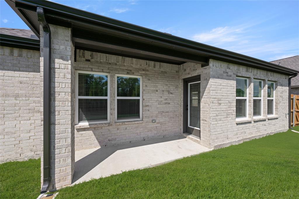 1850 Silver Birch Road Waxahachie, TX 75165 - Photo 32 of 36 a front view of a house with a yard