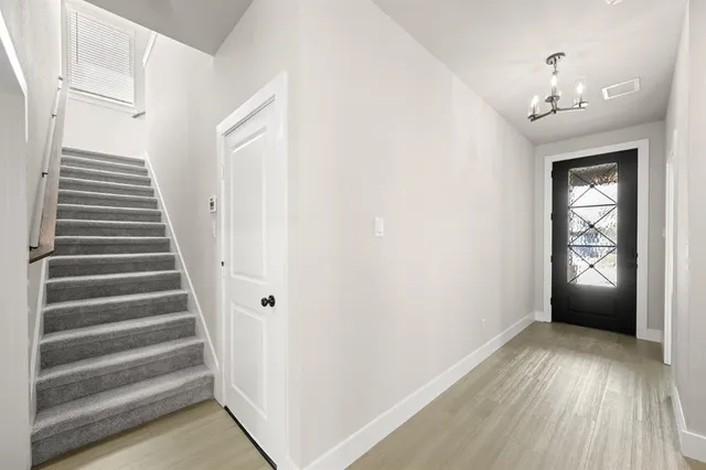 a kitchen with kitchen island a sink stove and refrigerator