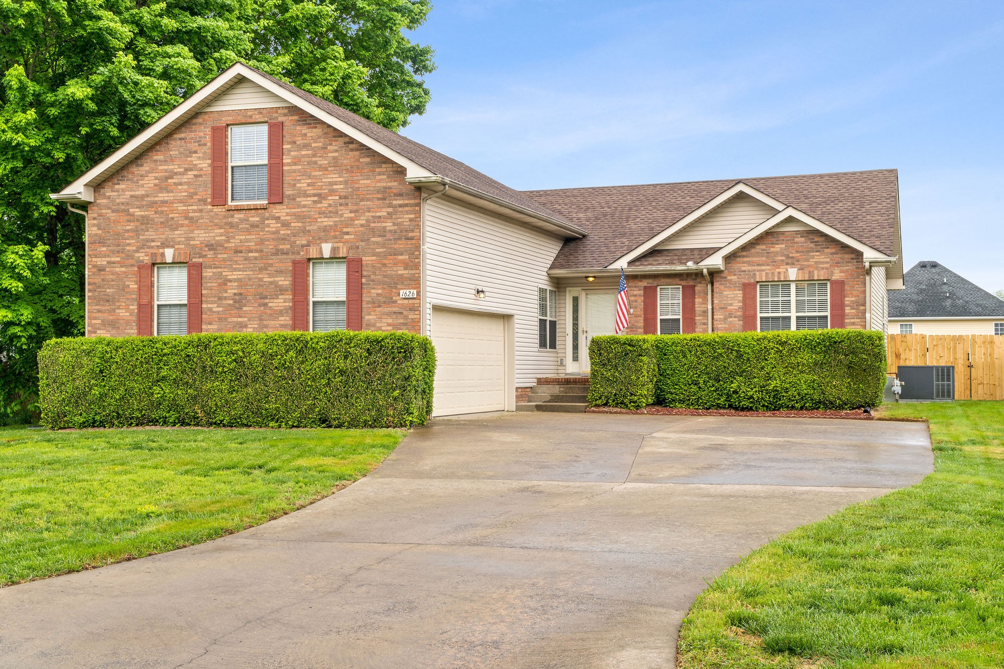 1626 Windriver Road Clarksville, TN 37042 - Photo 2 of 31 a front view of a house with a yard and garage