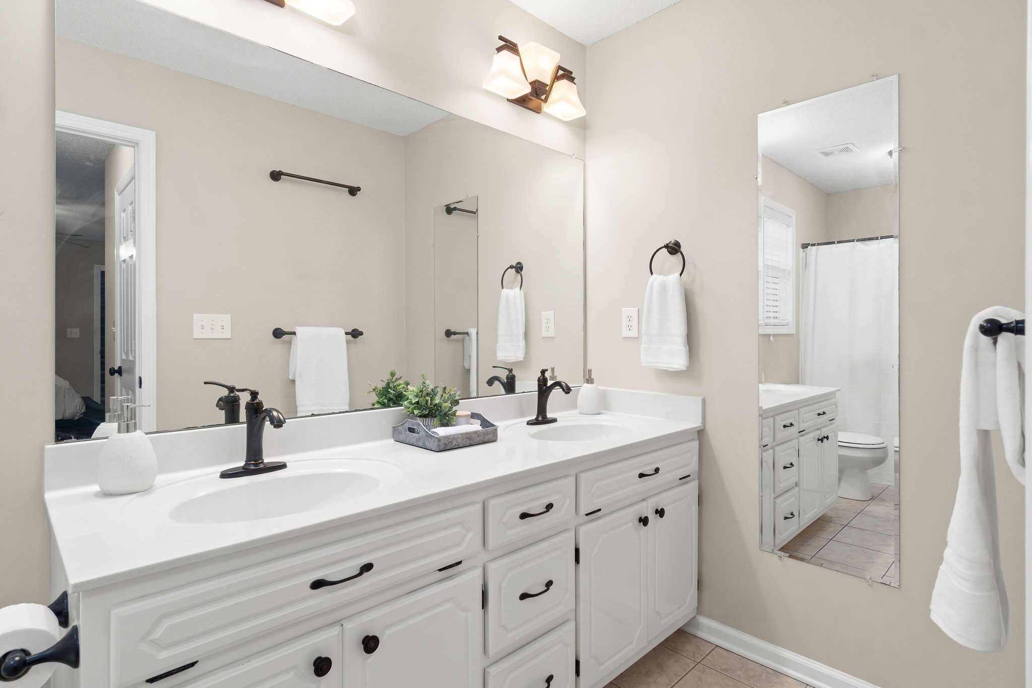 1626 Windriver Road Clarksville, TN 37042 - Photo 19 of 31 a bathroom with a double vanity sink mirror and shower