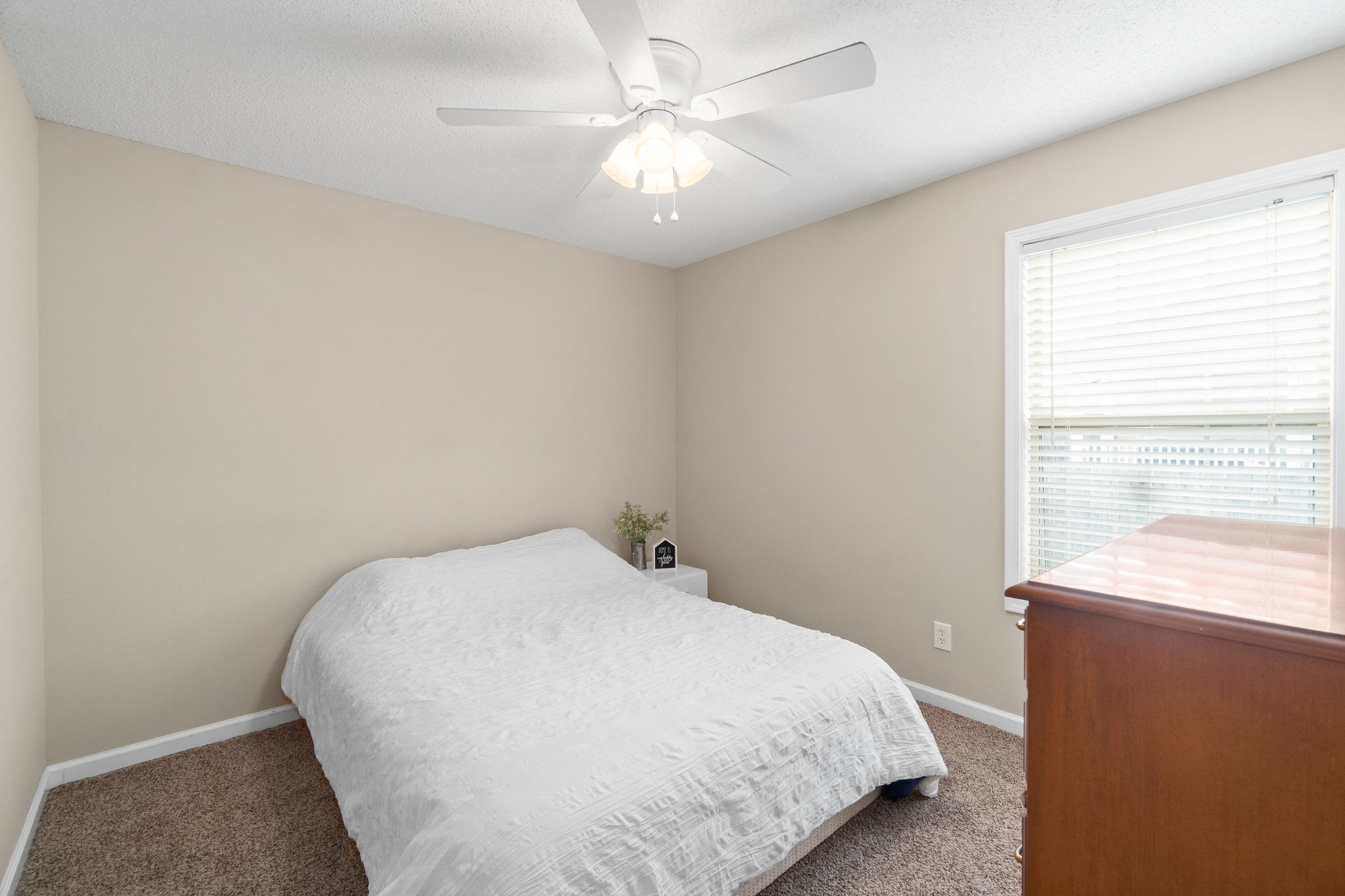 1626 Windriver Road Clarksville, TN 37042 - Photo 20 of 31 a bedroom with a bed and a chandelier