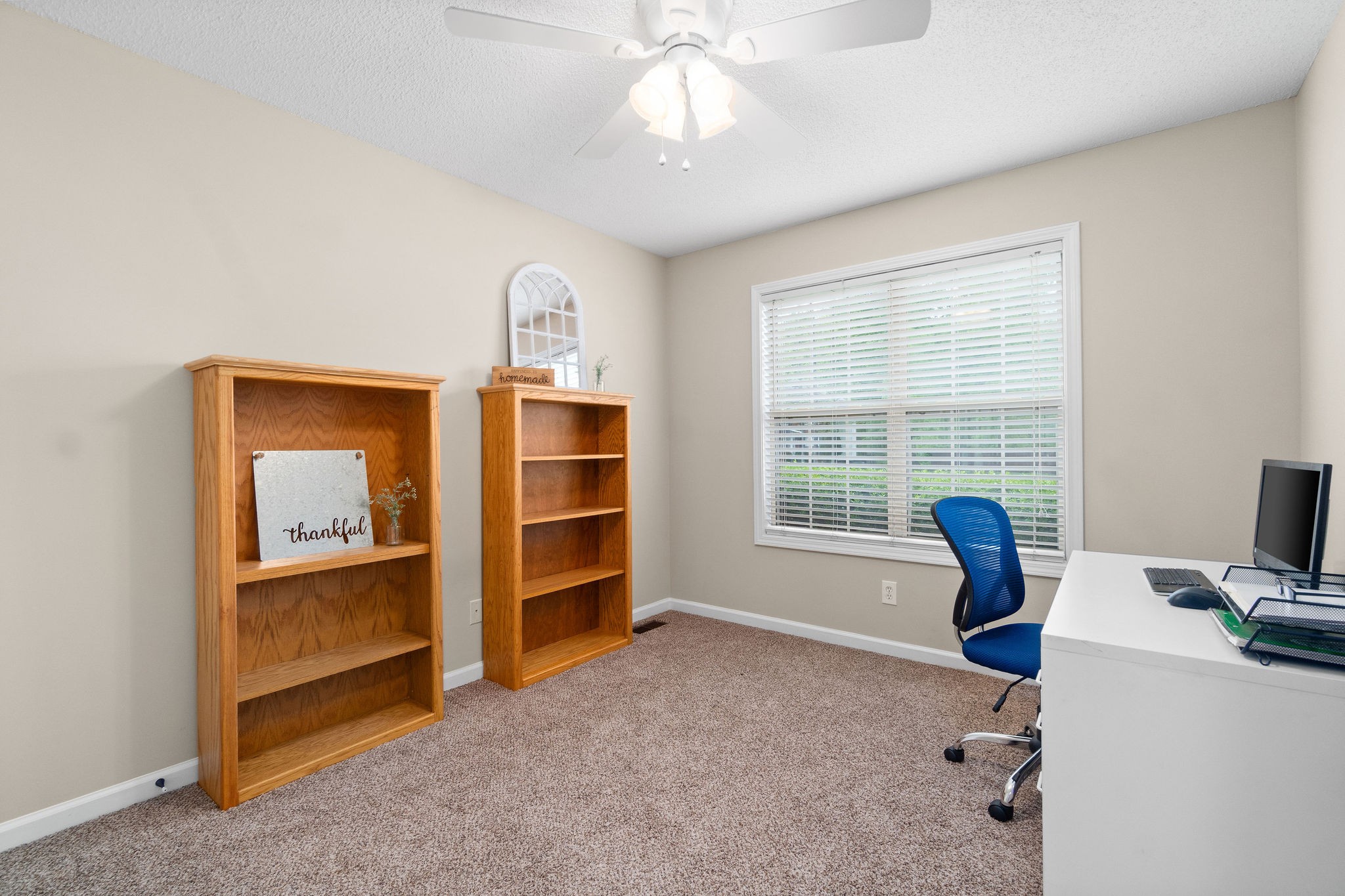 1626 Windriver Road Clarksville, TN 37042 - Photo 21 of 31 a view of a workspace with furniture and a window
