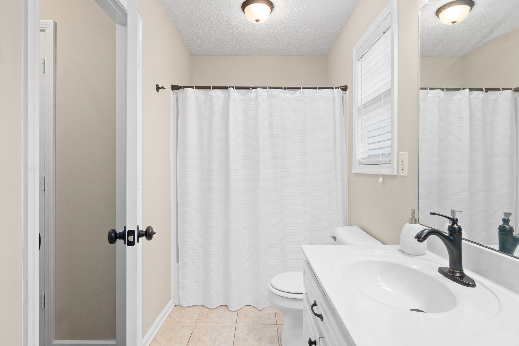 1626 Windriver Road Clarksville, TN 37042 - Photo 22 of 31 a bathroom with a sink toilet and shower