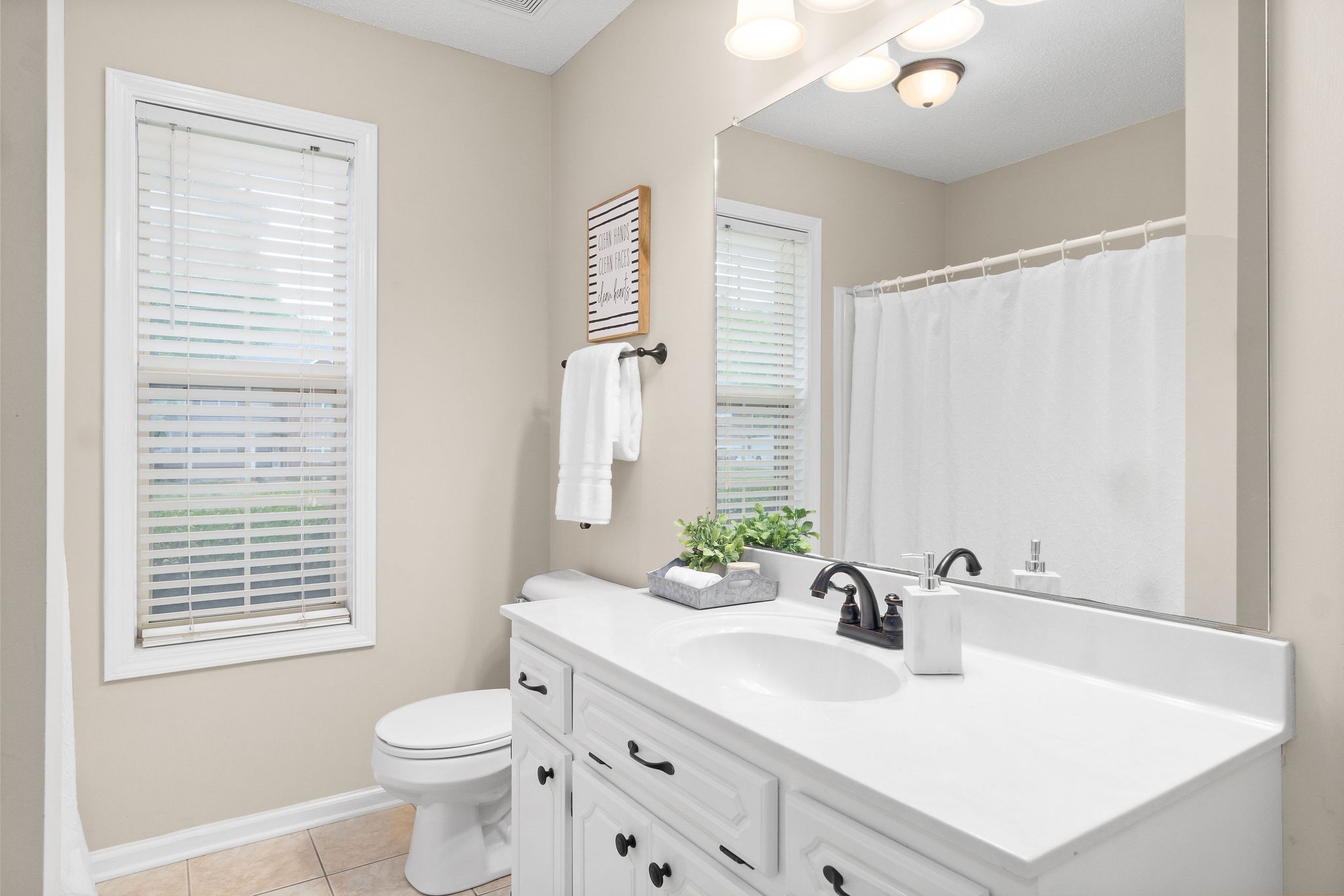 1626 Windriver Road Clarksville, TN 37042 - Photo 23 of 31 a bathroom with a sink toilet vanity and tub