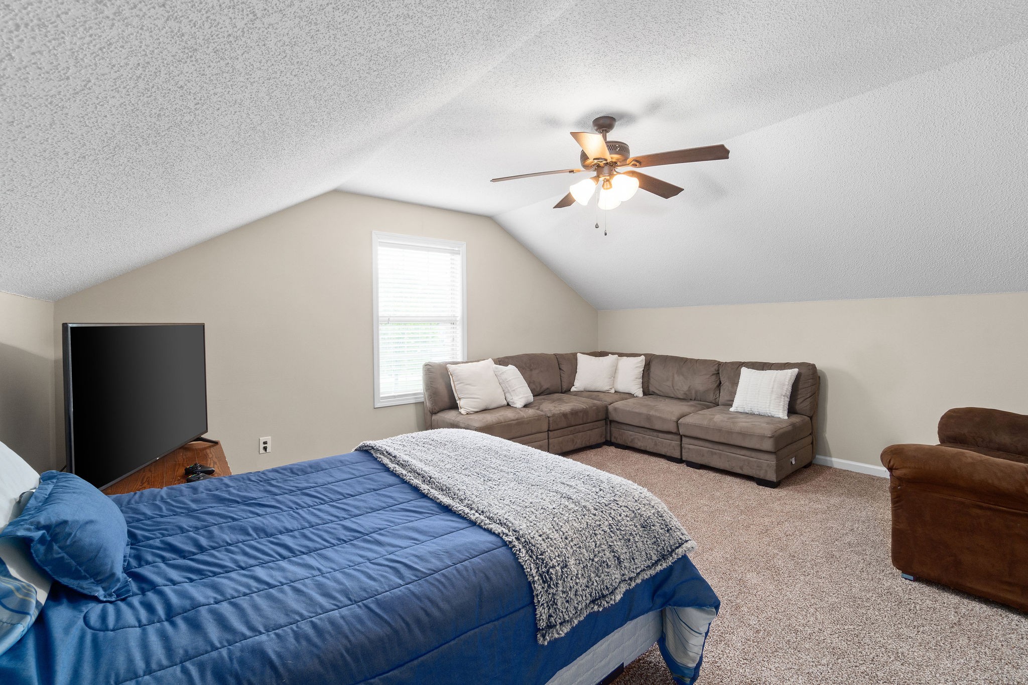 1626 Windriver Road Clarksville, TN 37042 - Photo 24 of 31 a bedroom with bed and a chandelier