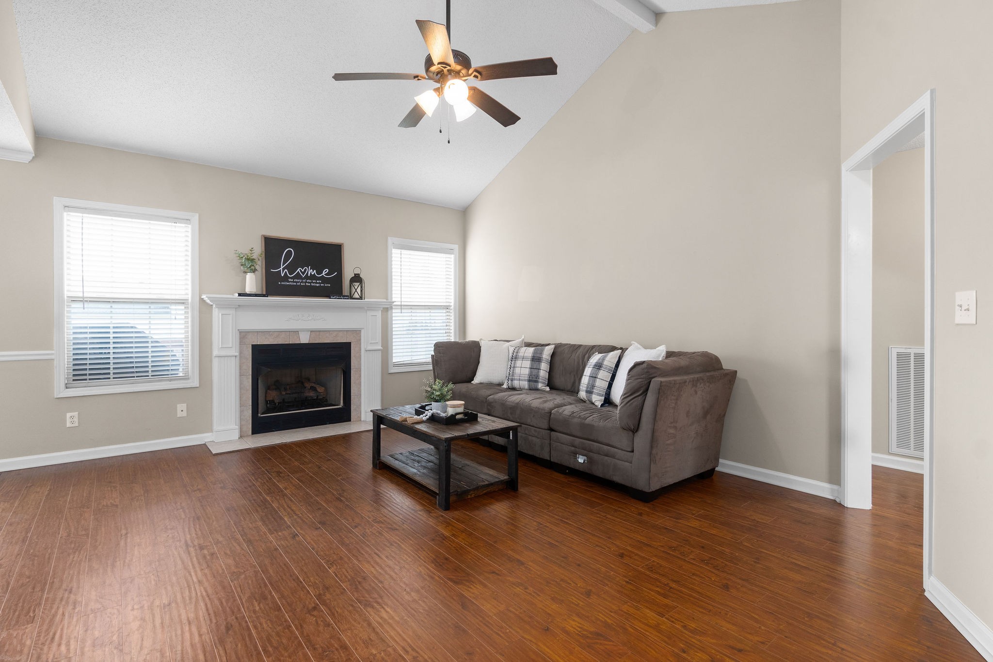 1626 Windriver Road Clarksville, TN 37042 - Photo 4 of 31 a living room with furniture a flat screen tv and a fireplace