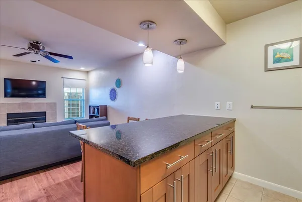 a kitchen with a stove a sink and a refrigerator