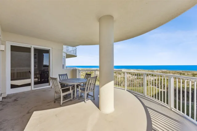 a view of a chairs and table in patio