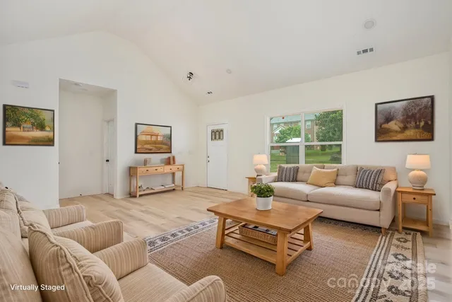 a living room with furniture and a window
