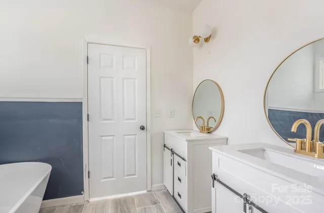 a view of bathroom with dual sinks