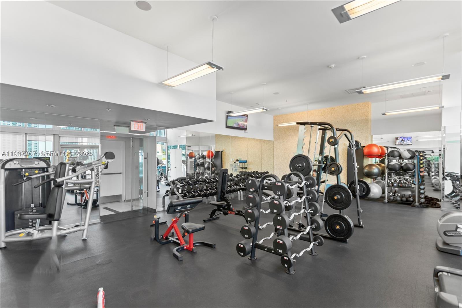 92 Southwest 3rd Street, Unit 4109 Miami, FL 33130 - Photo 23 of 23 a view of a room with gym equipment