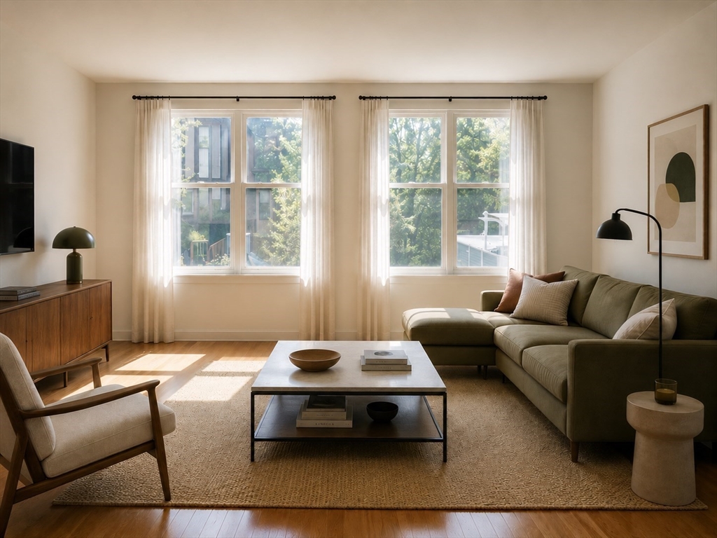 20 Webster Street, Unit 211 Brookline, MA 02446 - Photo 2 of 8 a living room with furniture and a window