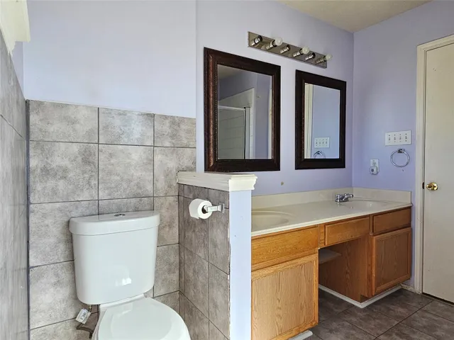 a bathroom with a bath tub with a shower