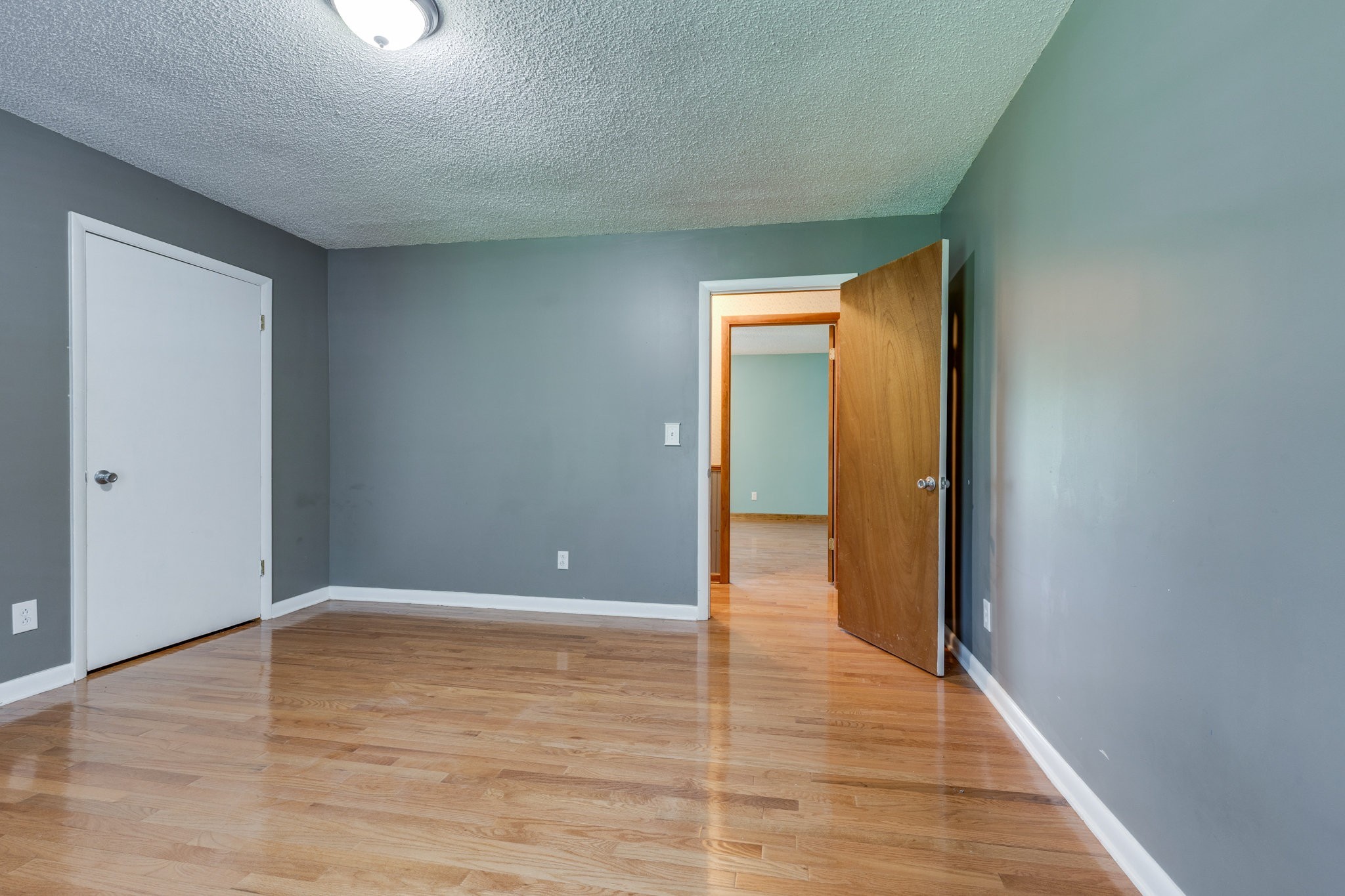 1087 Charley Davis Road Goodspring, TN 38460 - Photo 24 of 80 a view of an empty room with wooden floor