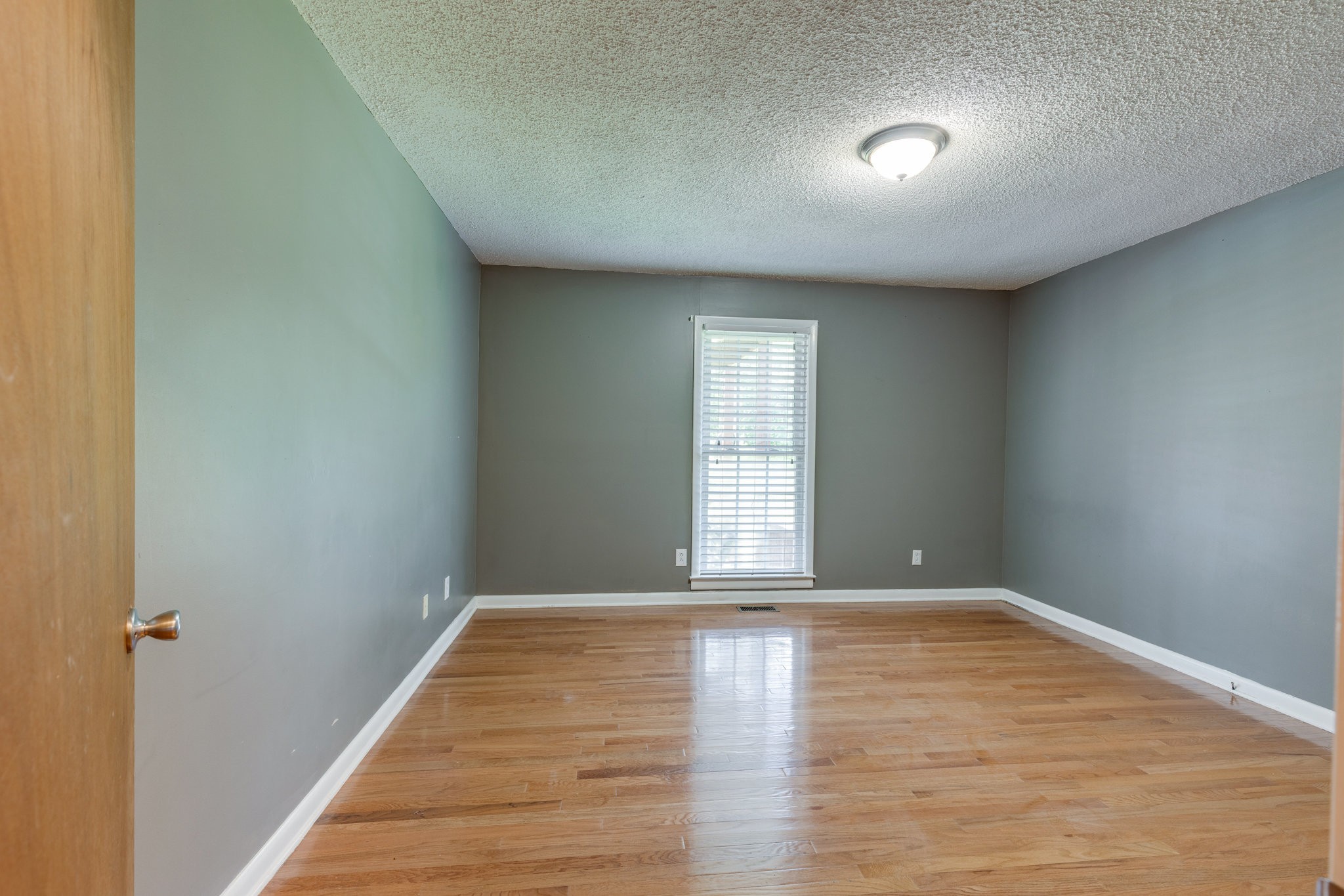 1087 Charley Davis Road Goodspring, TN 38460 - Photo 25 of 80 a view of empty room with wooden floor and fan