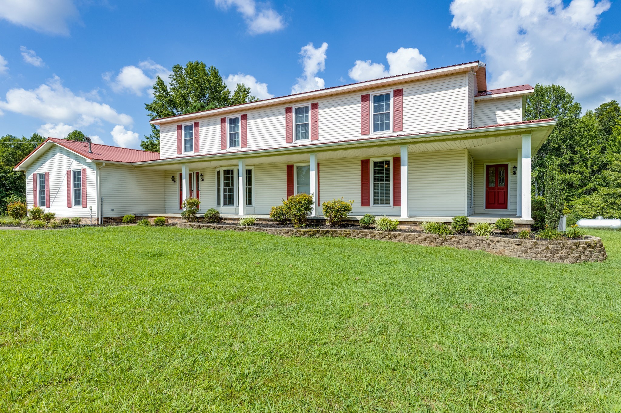 1087 Charley Davis Road Goodspring, TN 38460 - Photo 43 of 80 a front view of a house with a yard table and chairs