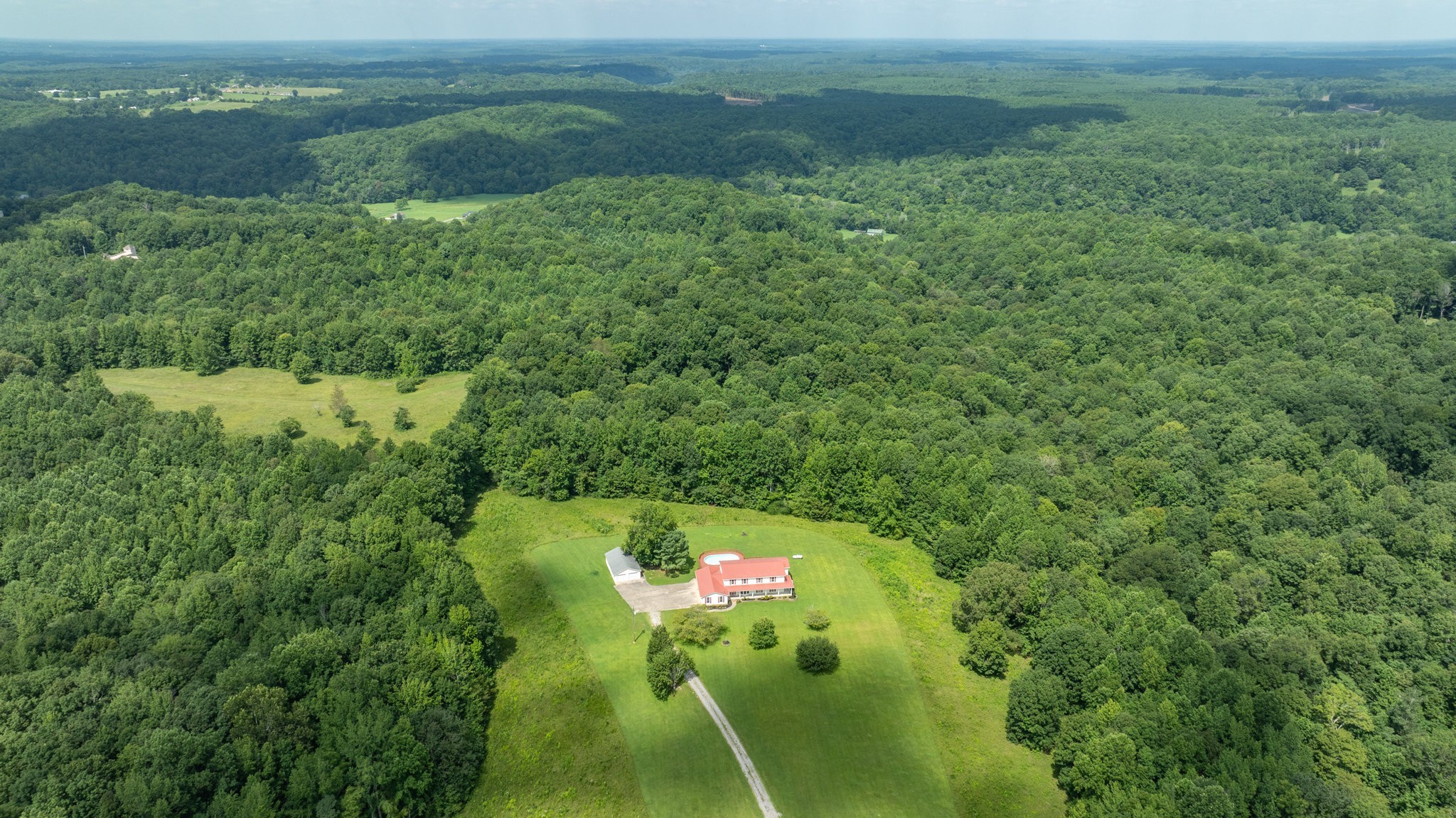 1087 Charley Davis Road Goodspring, TN 38460 - Photo 66 of 80 a backyard of a house with a yard and outdoor seating