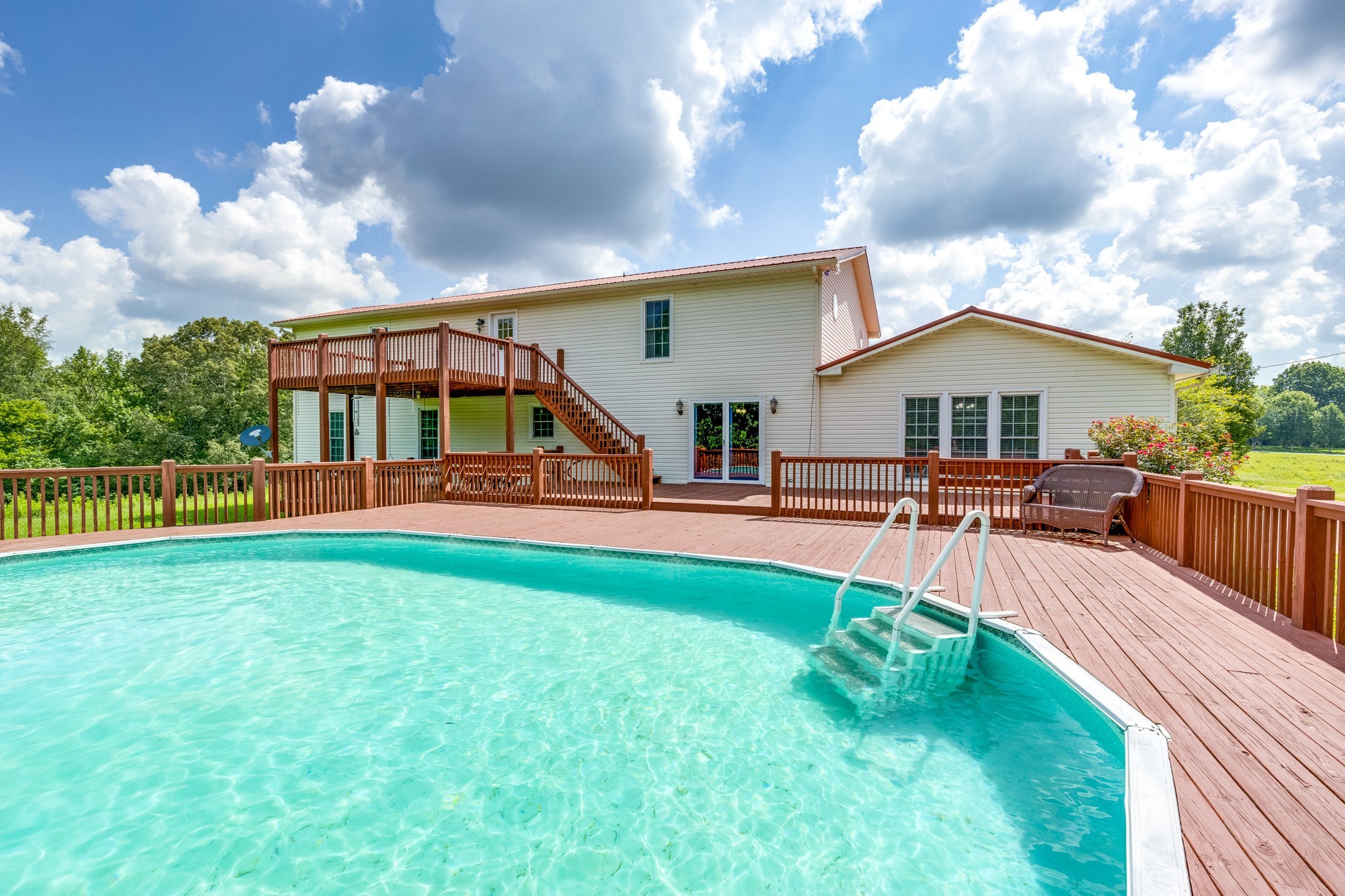 1087 Charley Davis Road Goodspring, TN 38460 - Photo 75 of 80 a view of a house with swimming pool and sitting area