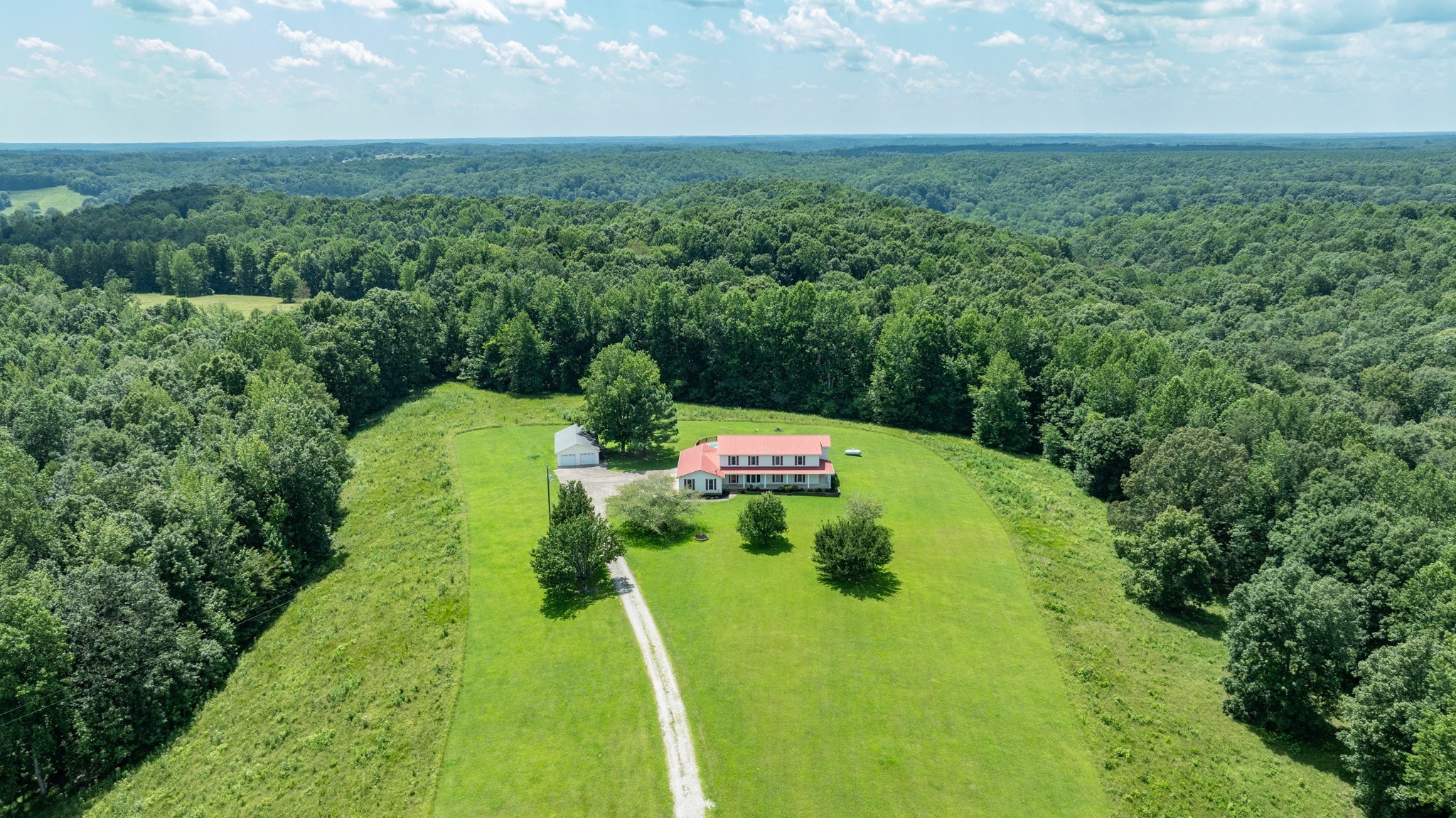 1087 Charley Davis Road Goodspring, TN 38460 - Photo 80 of 80 a view of a garden with a building in the background