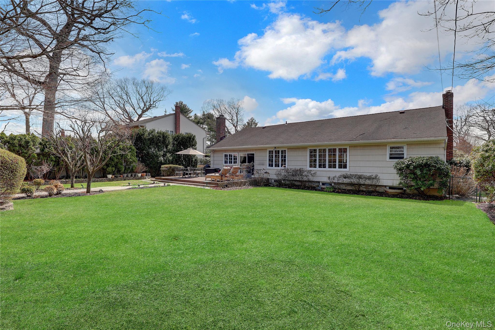 27 Cedar Street Syosset, NY 11791 - Photo 26 of 28 a view of a house with a big yard