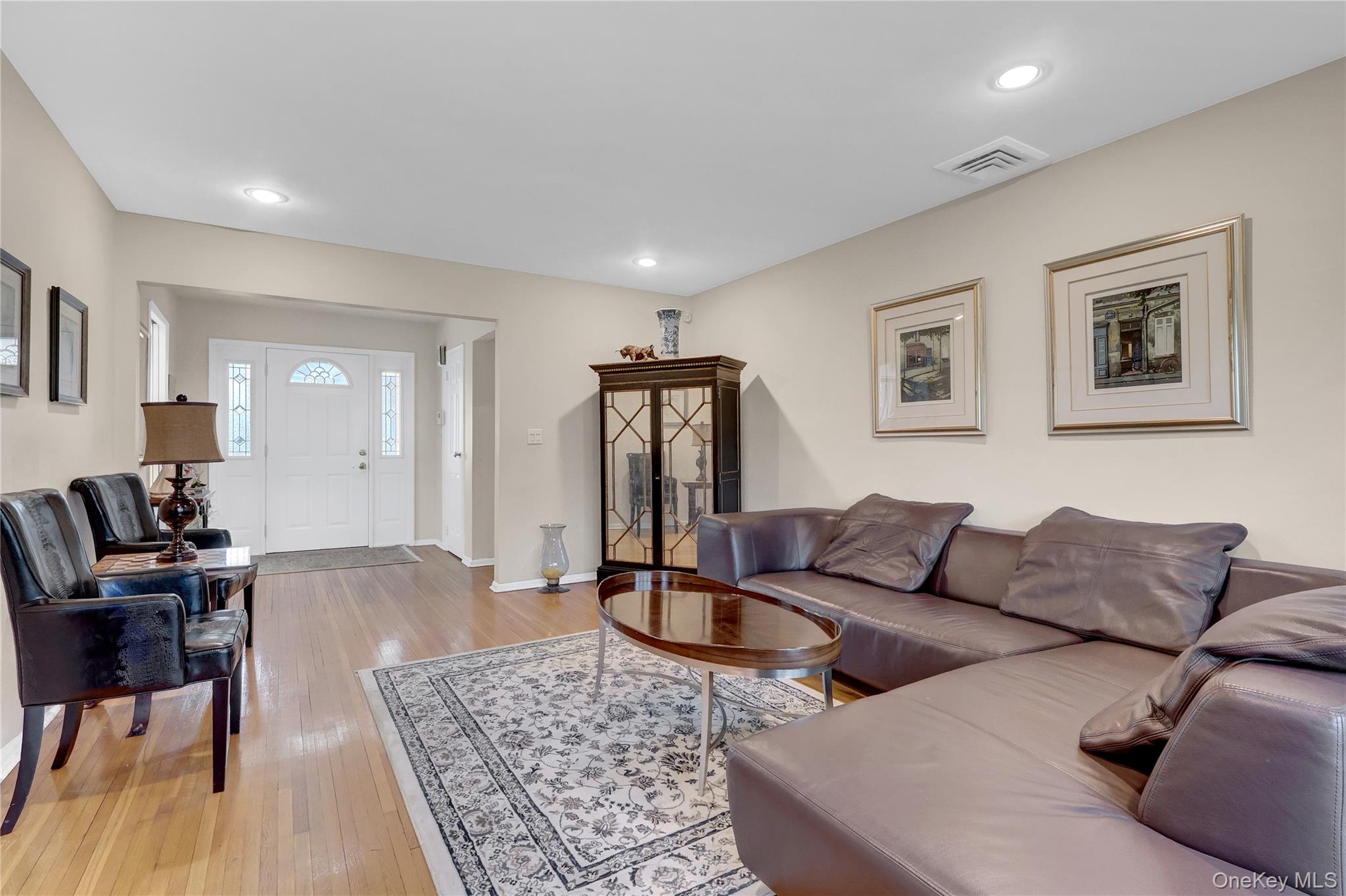 27 Cedar Street Syosset, NY 11791 - Photo 6 of 28 a living room with furniture rug and wooden floor