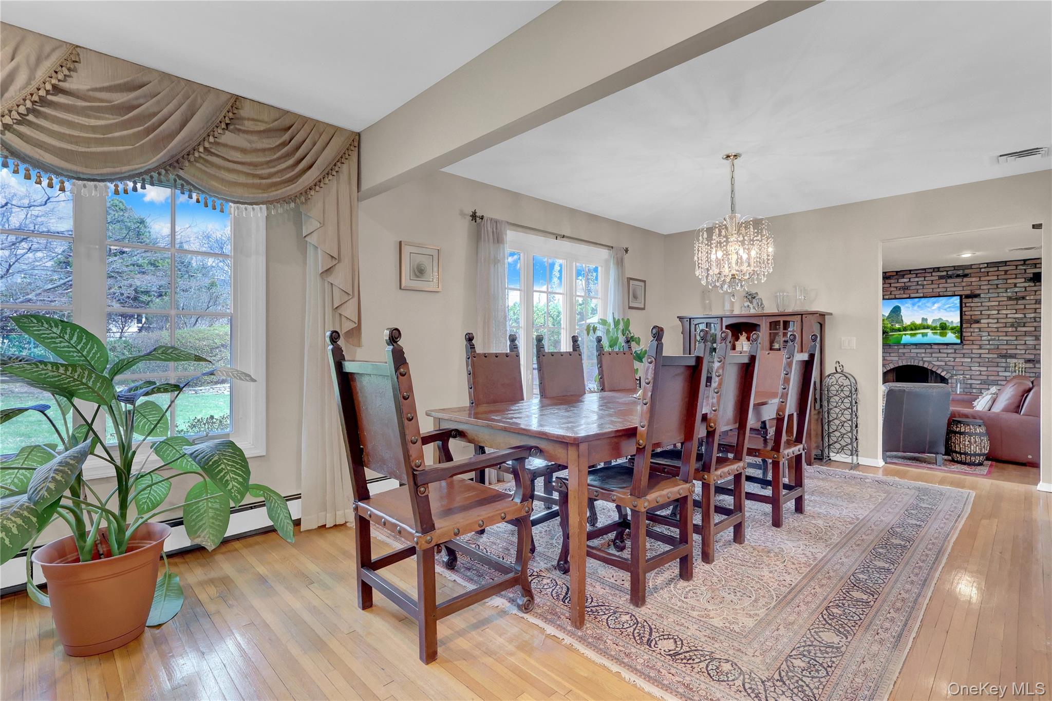 27 Cedar Street Syosset, NY 11791 - Photo 7 of 28 a view of a dining room with furniture window and wooden floor