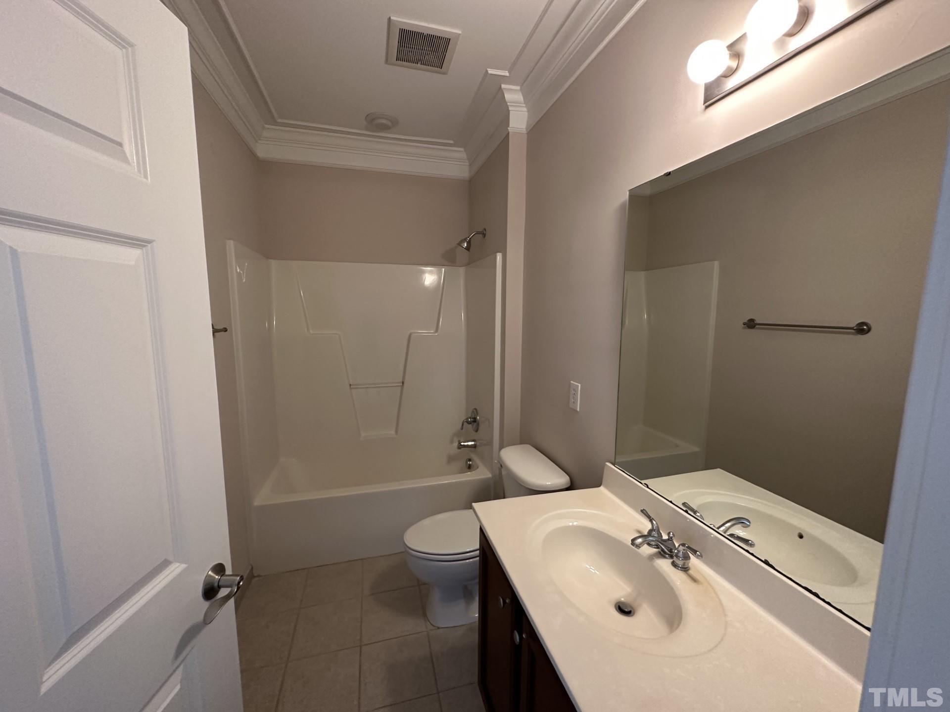 623 Waterford Lake Drive, Unit 623 Cary, NC 27519 - Photo 12 of 18 a bathroom with a sink a toilet and shower