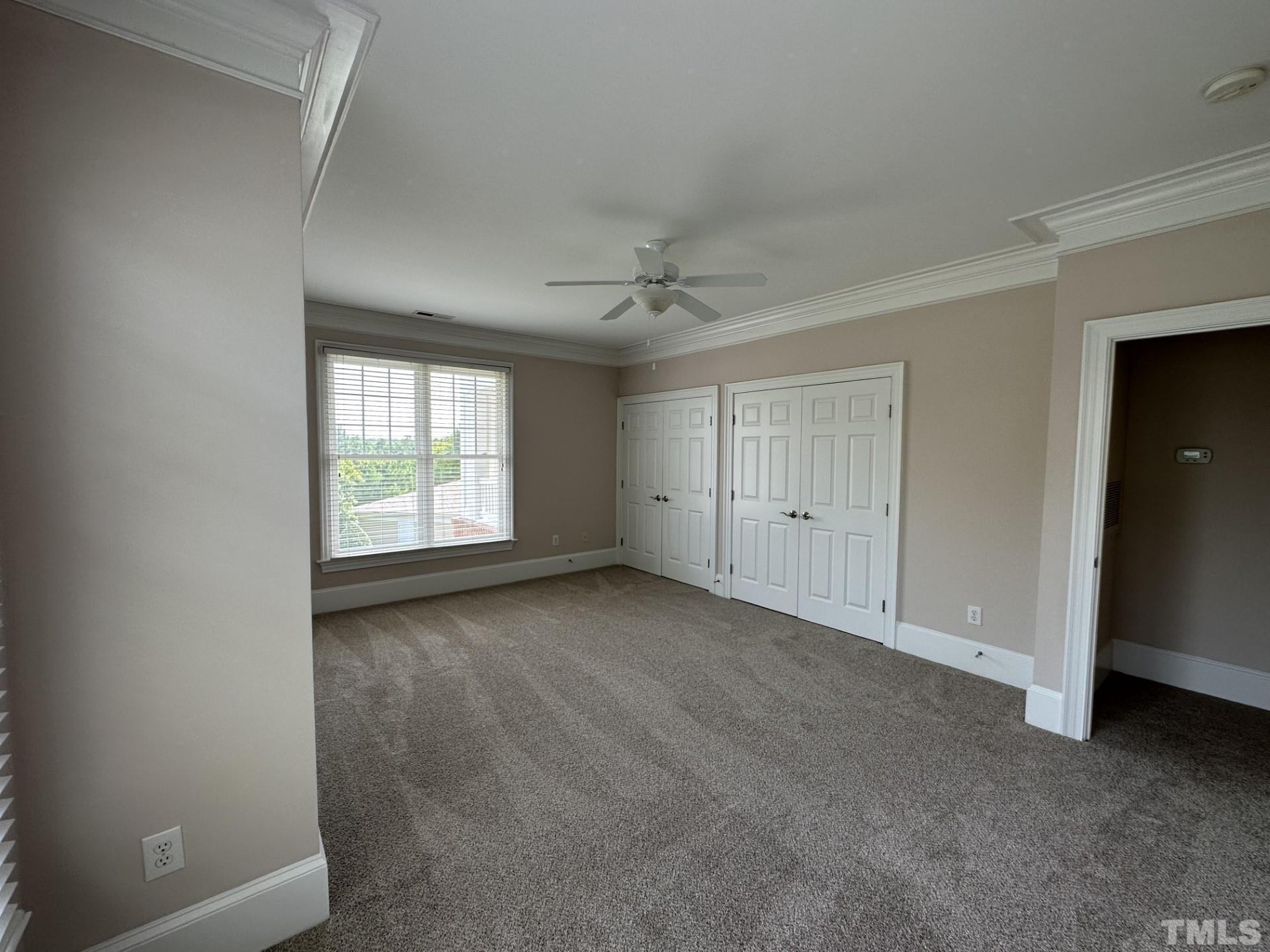 623 Waterford Lake Drive, Unit 623 Cary, NC 27519 - Photo 15 of 18 an empty room with a window and a fan