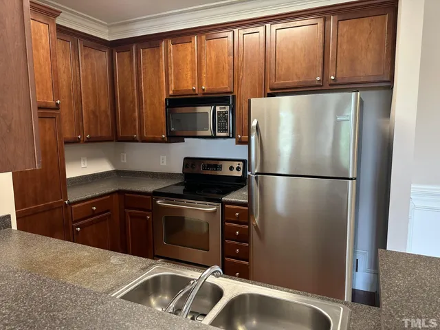 a bathroom with a toilet a sink and a mirror