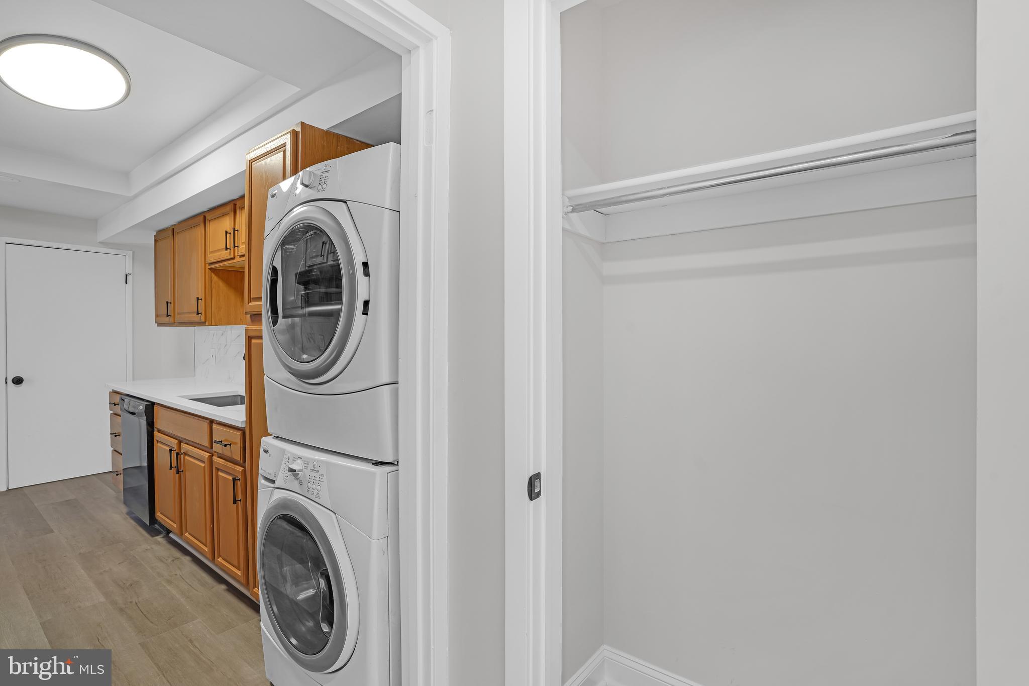 10239 Prince Place, Unit 26103 Upper Marlboro, MD 20774 - Photo 13 of 25 a utility room with dryer and washer
