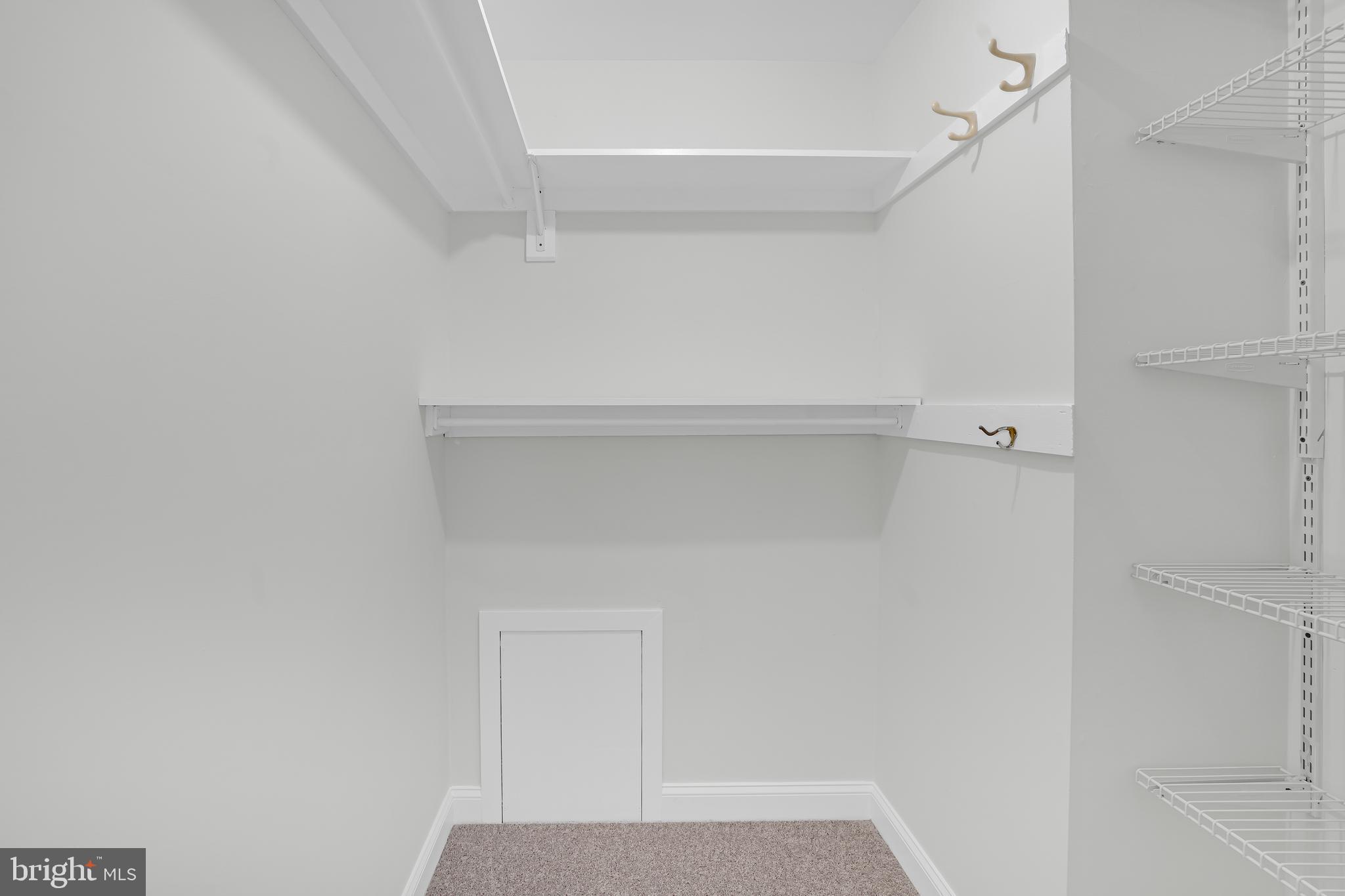 10239 Prince Place, Unit 26103 Upper Marlboro, MD 20774 - Photo 19 of 25 a view of small space with racks on the wall