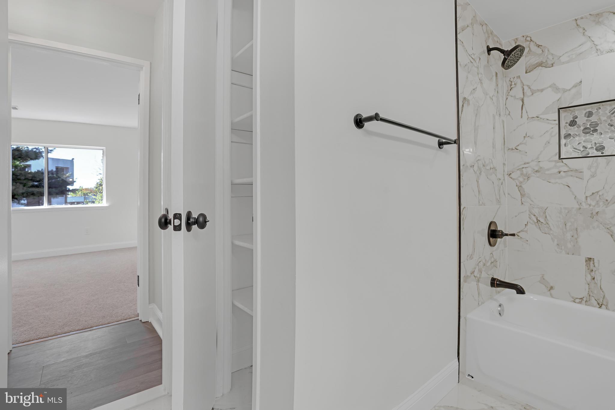 10239 Prince Place, Unit 26103 Upper Marlboro, MD 20774 - Photo 22 of 25 a bathroom with a bathtub