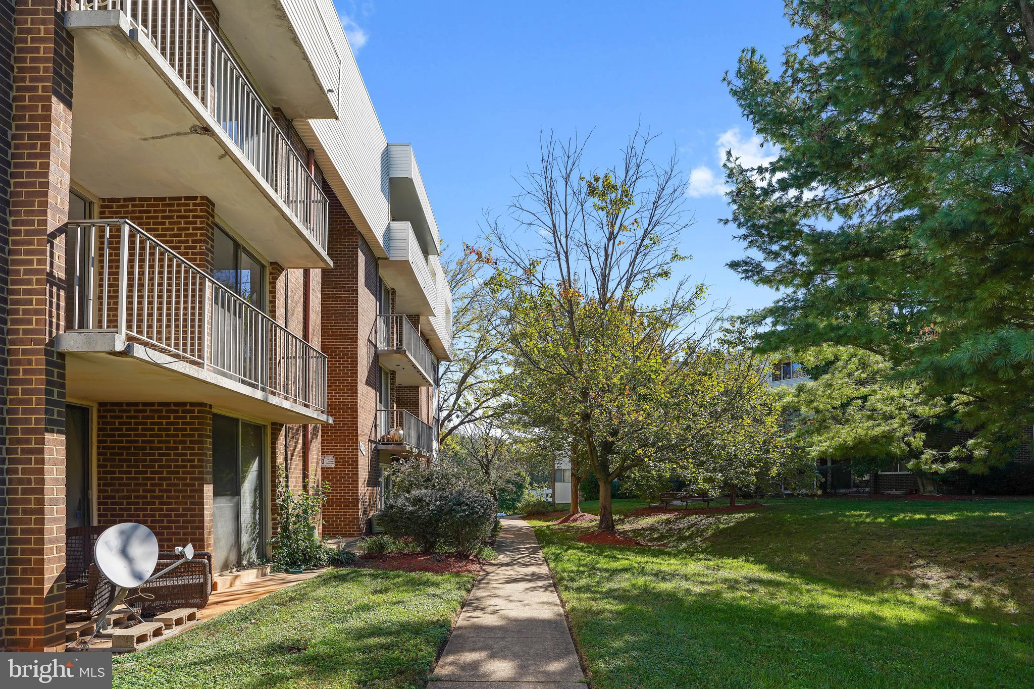 10239 Prince Place, Unit 26103 Upper Marlboro, MD 20774 - Photo 24 of 25 a front view of a house with garden