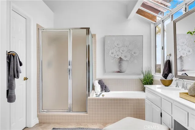 a bathroom with a tub shower and sink