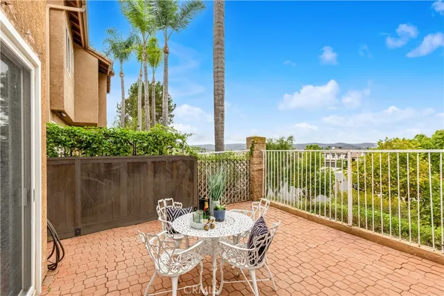 a view of a balcony with lake view and wooden floor