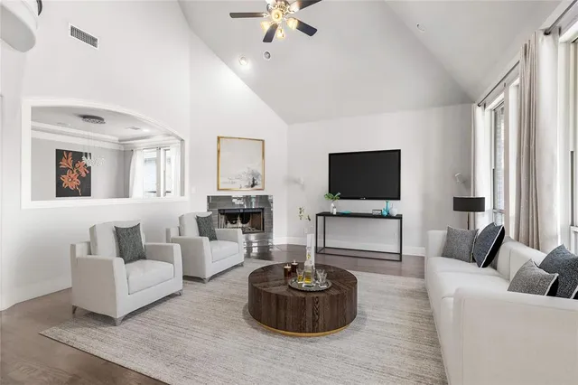 a bathroom with a bathtub a sink a mirror and a shower