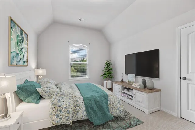 a view of a patio with a table and chairs and wooden fence