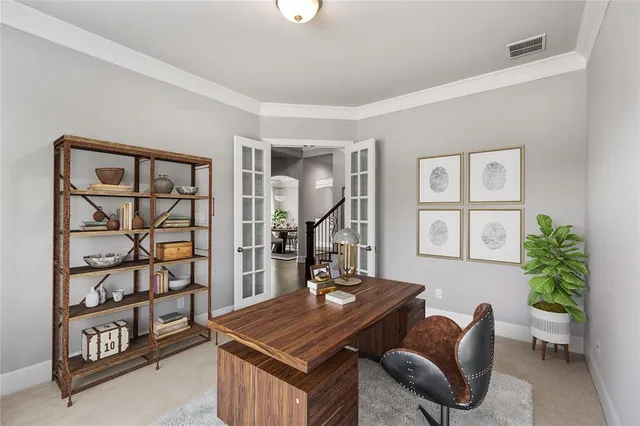 a dining room with furniture potted plants and wooden floor